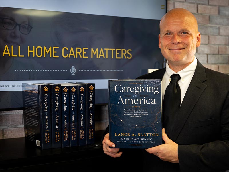 Lance A. Slatton holding Caregiving in America